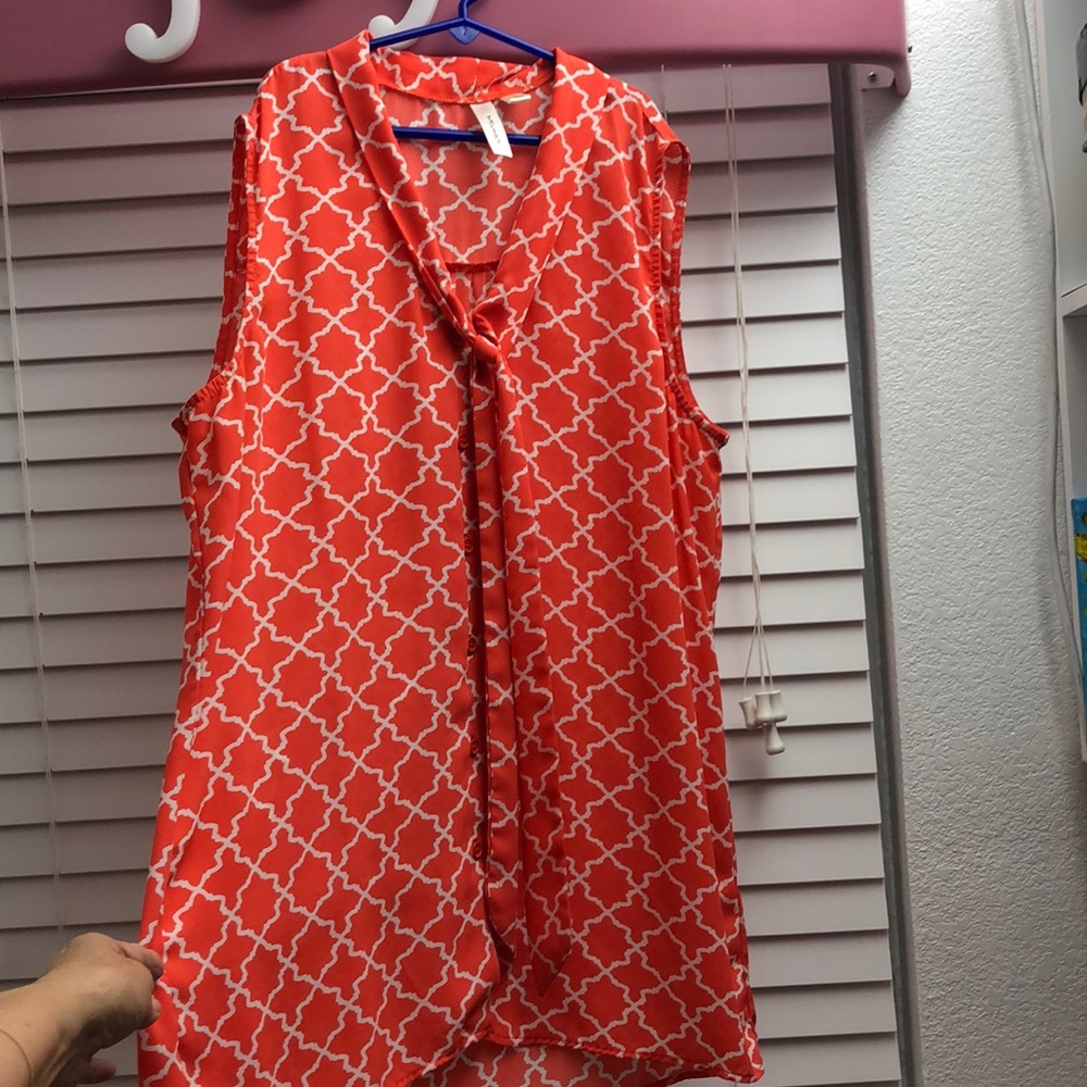 Orange and white sleeveless blouse size large